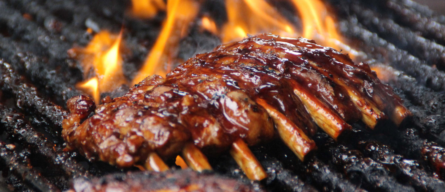 ribs on fire on the grill