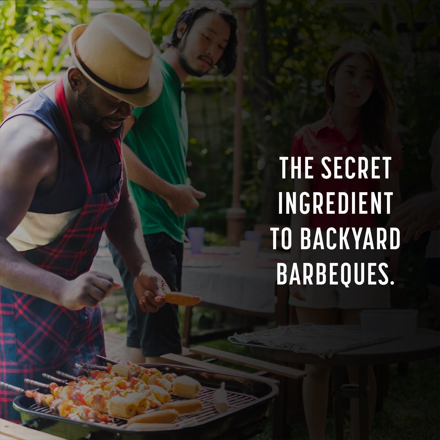 Man sprinkling spice on barbecue skewers overlayed with text reading: the secret ingredient to backyard barbecues.